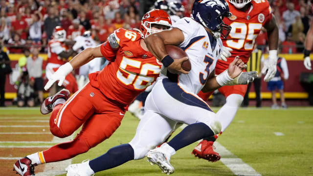 Oct 12, 2023; Kansas City, Missouri, USA; Denver Broncos quarterback Russell Wilson (3) runs the ball as Kansas City Chiefs defensive end George Karlaftis (56) chases during the second half at GEHA Field at Arrowhead Stadium. Mandatory Credit: Denny Medley-USA TODAY Sports  